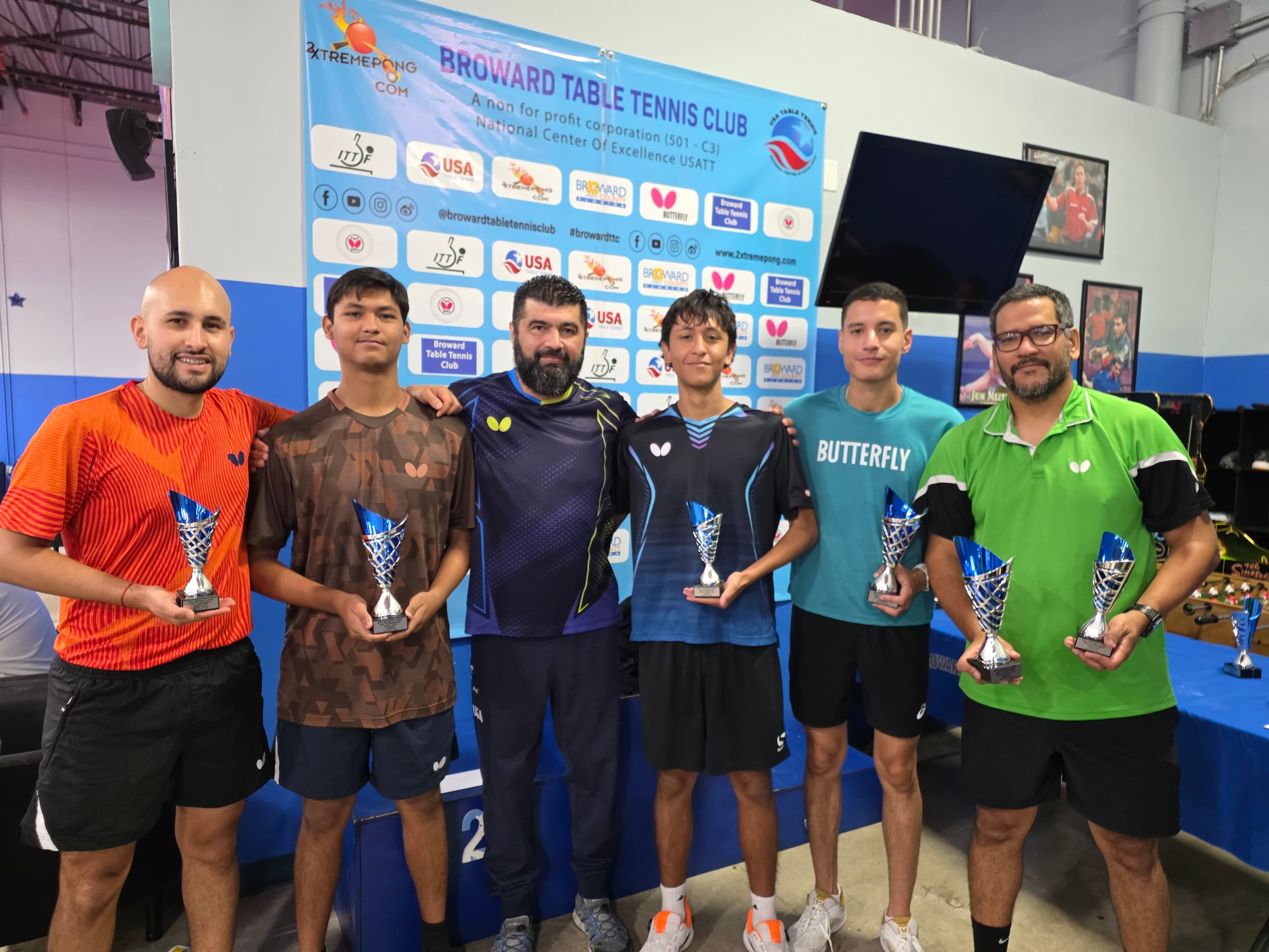 Coach David Bonilla with tournament trophy winners