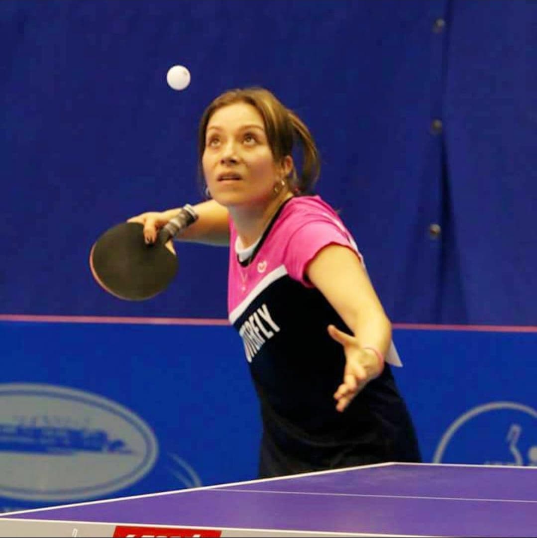 Coach Lady Ruano serving